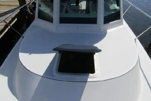Slide: The Image of 2000 Albin 28 Tournament Express boat with open hatch on deck. - 4