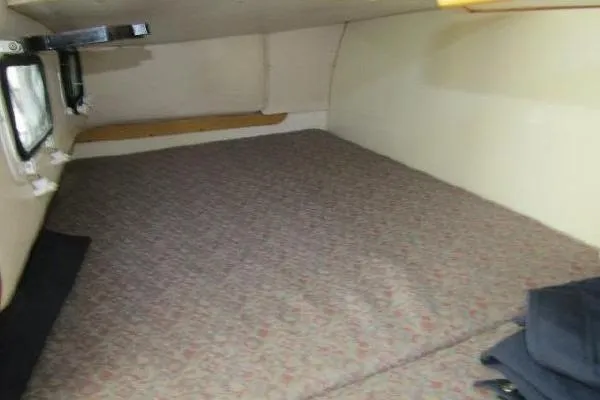 Slide: The Image of Interior cabin of 2000 Albin 28 Tournament Express with cushioned sleeping area. - 43