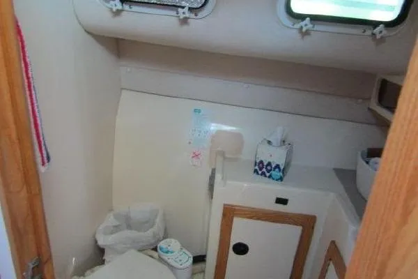 Slide: The Image of Bathroom interior of 2000 Albin 28 Tournament Express boat, featuring compact design and amenities. - 45