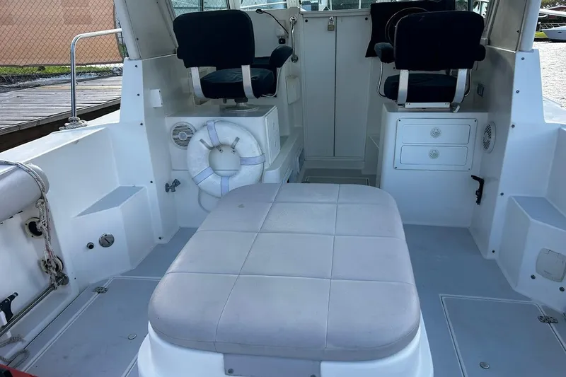 Slide: The Image of Interior of a 2000 Albin 28 Tournament Express boat with seating and storage. - 9