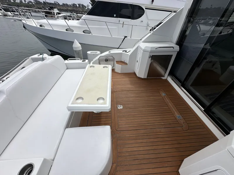 Slide: The Image of Deck of a 2014 Cruisers Yachts 48 Cantius with wooden flooring. - 1