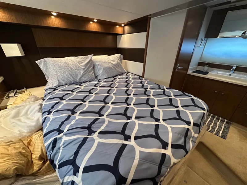Slide: The Image of Luxurious bedroom on a 2014 Cruisers Yachts 48 Cantius. - 12