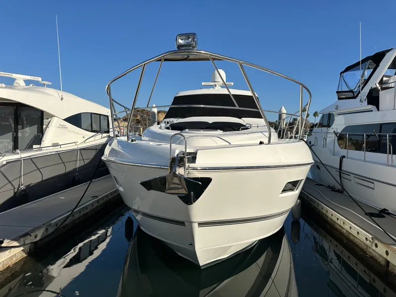 Slide: The Image of 2014 Cruisers Yachts 48 Cantius docked, sunny day. - 14