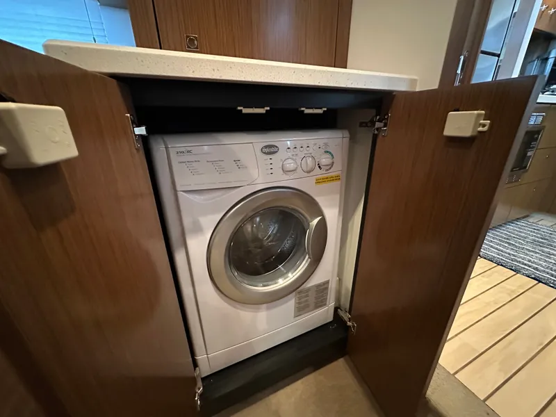 Slide: The Image of Washing machine installed in 2014 Cruisers Yachts 48 Cantius. - 24