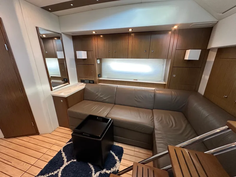 Slide: The Image of Interior of a 2014 Cruisers Yachts 48 Cantius with leather sofa. - 27
