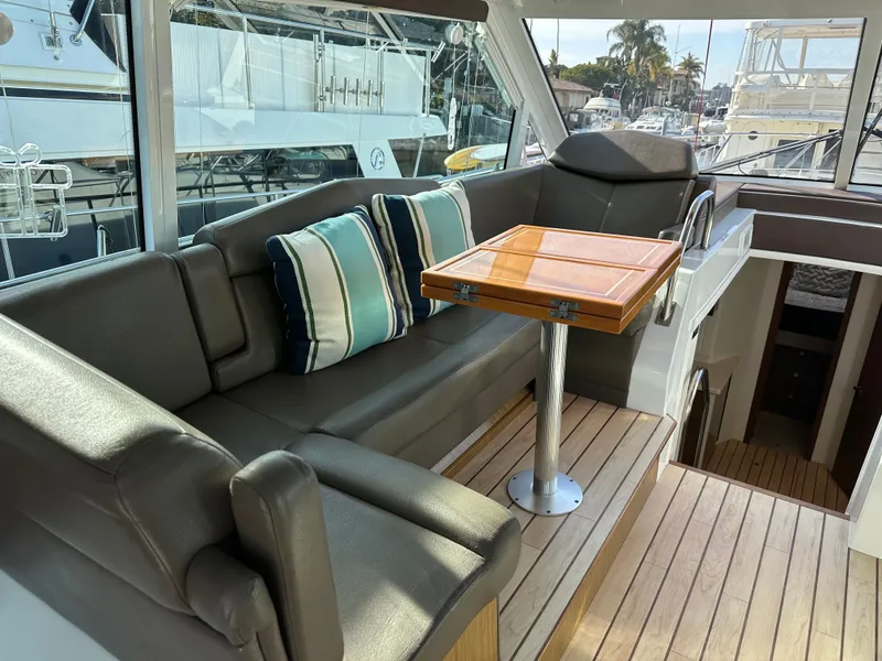 Slide: The Image of Interior of 2014 Cruisers Yachts 48 Cantius with seating area and table. - 29