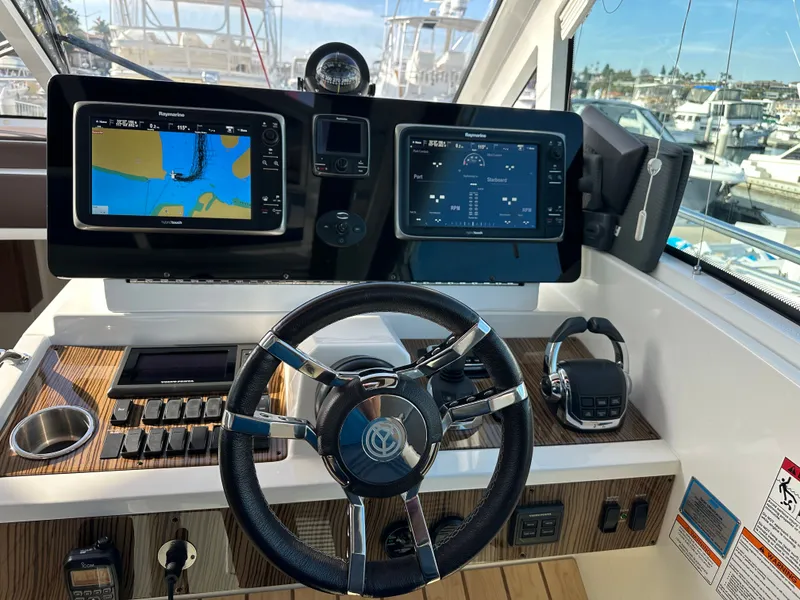 Slide: The Image of Cruisers Yachts 48 Cantius 2014 helm with navigation system. - 3