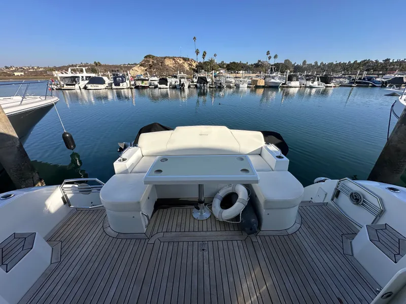 Slide: The Image of 2014 Cruisers Yachts 48 Cantius docked with scenic marina view. - 31