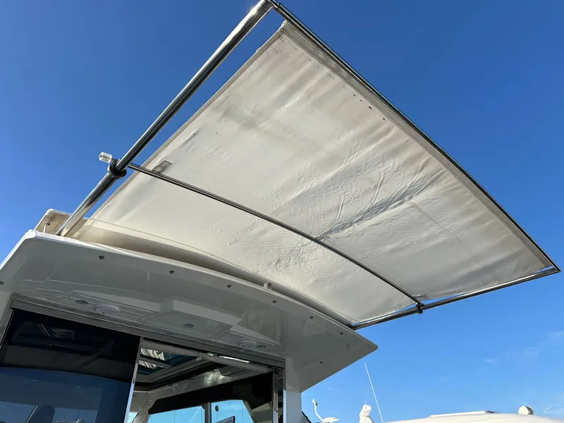 Slide: The Image of Sunshade on 2014 Cruisers Yachts 48 Cantius under blue sky. - 32