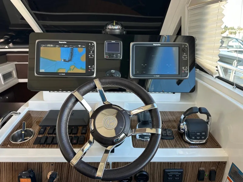 Slide: The Image of 2014 Cruisers Yachts 48 Cantius helm with navigation system. - 36