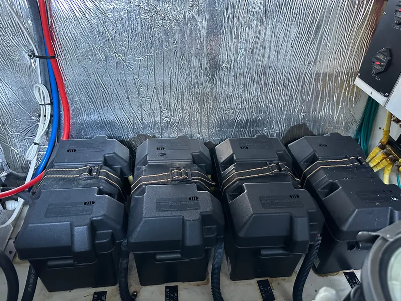 Slide: The Image of Batteries in the engine room of a 2014 Cruisers Yachts 48 Cantius. - 37
