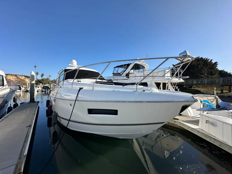 Slide: The Image of 2014 Cruisers Yachts 48 Cantius docked in sunny marina. - 4