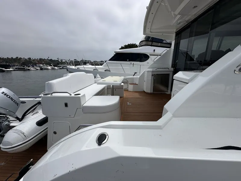 Slide: The Image of 2014 Cruisers Yachts 48 Cantius on water, luxurious deck design. - 6
