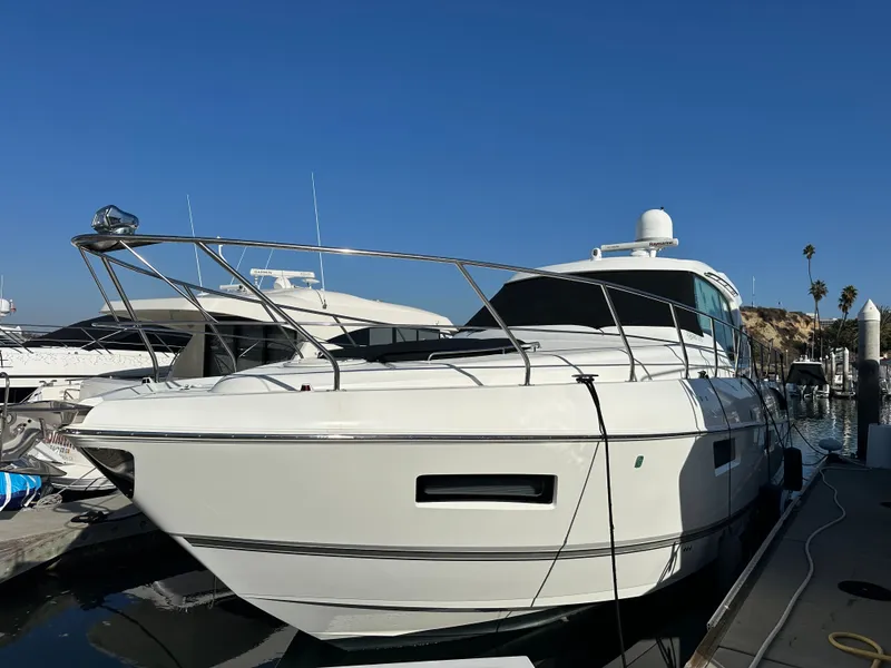 Slide: The Image of 2014 Cruisers Yachts 48 Cantius docked under clear sky. - 7