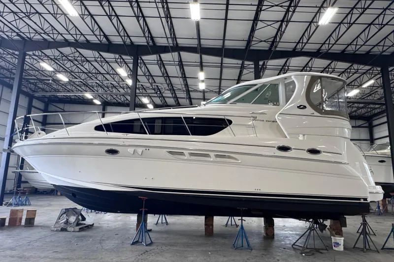 The Image of 2004 Sea Ray 390 Motor Yacht in a spacious indoor storage facility. - 0