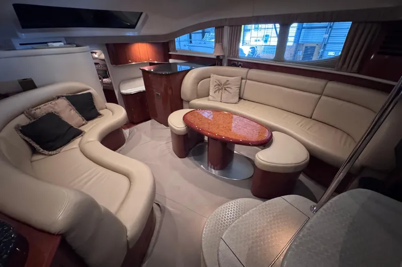 Slide: The Image of Luxurious interior of a 2004 Sea Ray 390 Motor Yacht with elegant seating and wooden accents. - 16
