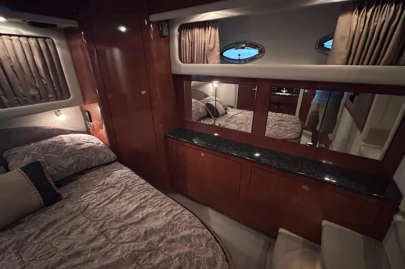 Slide: The Image of Luxurious 2004 Sea Ray 390 Motor Yacht interior with elegant seating and polished wood table. - 17