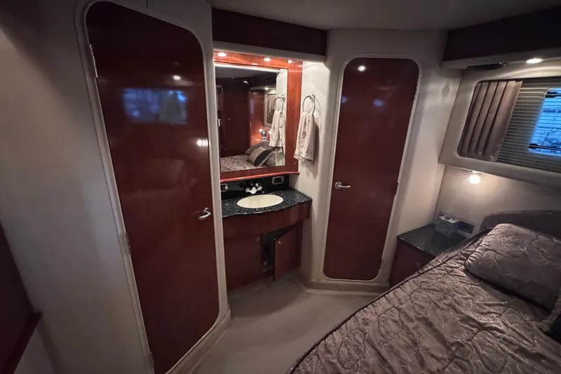 Slide: The Image of Luxurious interior of 2004 Sea Ray 390 Motor Yacht with leather seating and TV. - 18