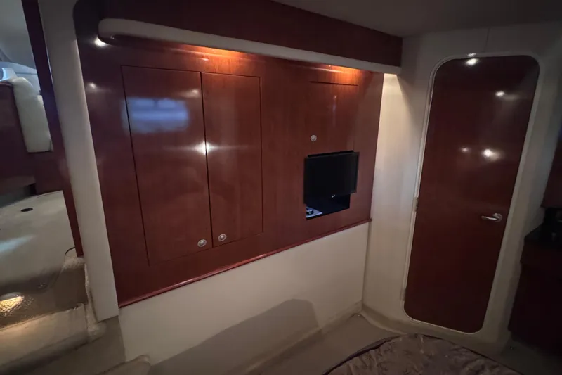 Slide: The Image of Luxurious bedroom interior of 2004 Sea Ray 390 Motor Yacht with elegant bedding and cabinetry. - 19