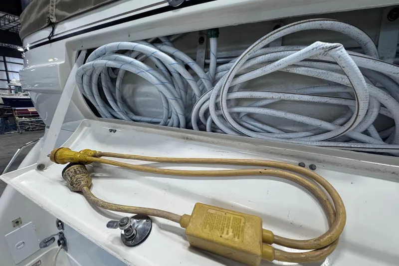 Slide: The Image of 2004 Sea Ray 390 Motor Yacht in a spacious indoor marina setting. - 2