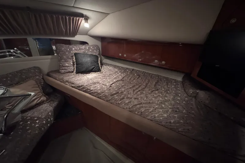 Slide: The Image of 2004 Sea Ray 390 Motor Yacht bathroom interior with toilet and mirror. - 23