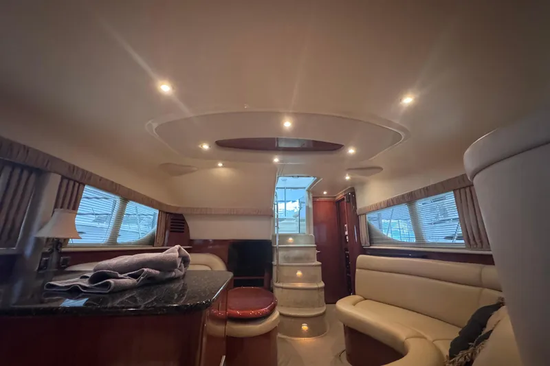 Slide: The Image of Shower area in 2004 Sea Ray 390 Motor Yacht with chrome fixtures and porthole window. - 25