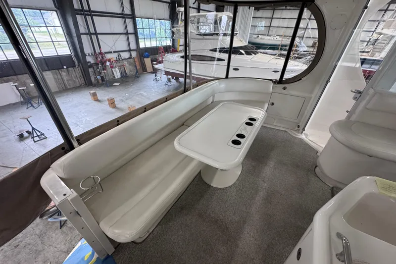 Slide: The Image of 2004 Sea Ray 390 Motor Yacht in a warehouse, elevated on stands. - 4