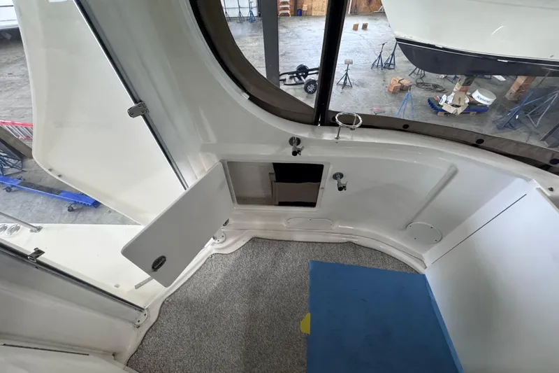 Slide: The Image of 2004 Sea Ray 390 Motor Yacht stern view in a marina setting. - 5