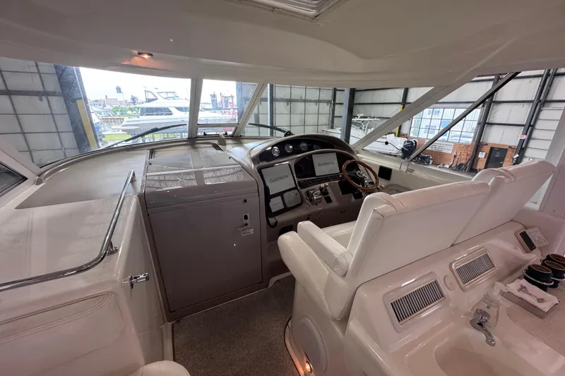 Slide: The Image of 2004 Sea Ray 390 Motor Yacht stern with Topinabee lettering and utility connections. - 7
