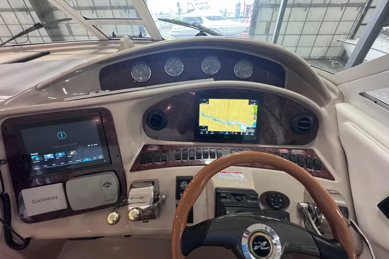 Slide: The Image of 2004 Sea Ray 390 Motor Yacht interior with open hatch and storage compartment. - 9