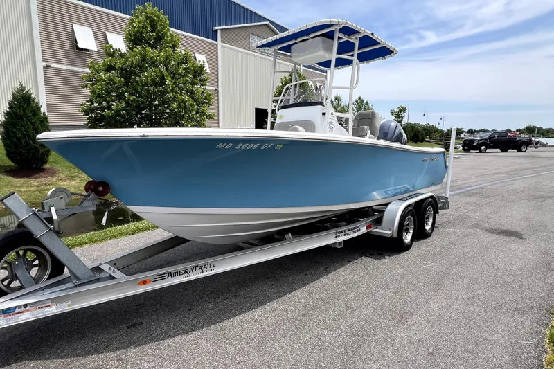 Slide: The Image of 2022 Sportsman Open 212 Center Console boat on trailer, parked outdoors. - 15