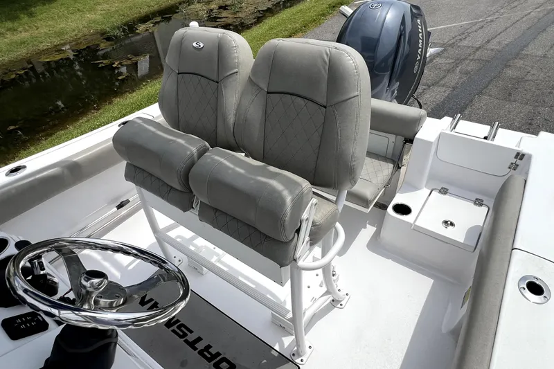 Slide: The Image of 2022 Sportsman Open 212 Center Console boat interior with dual seats and steering wheel. - 17