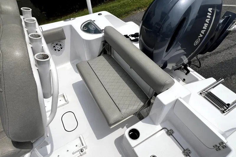 Slide: The Image of 2022 Sportsman Open 212 Center Console boat interior with Yamaha engine and seating. - 20
