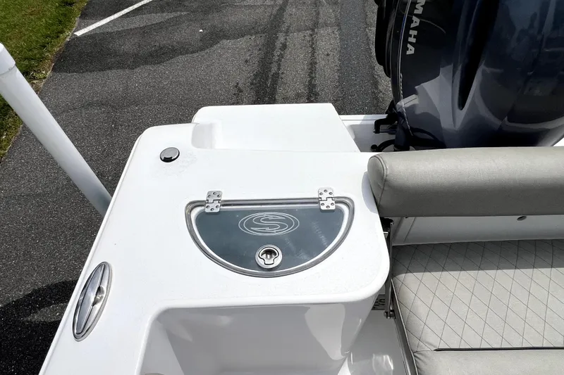 Slide: The Image of 2022 Sportsman Open 212 Center Console boat with Yamaha engine, featuring sleek seating and storage. - 23