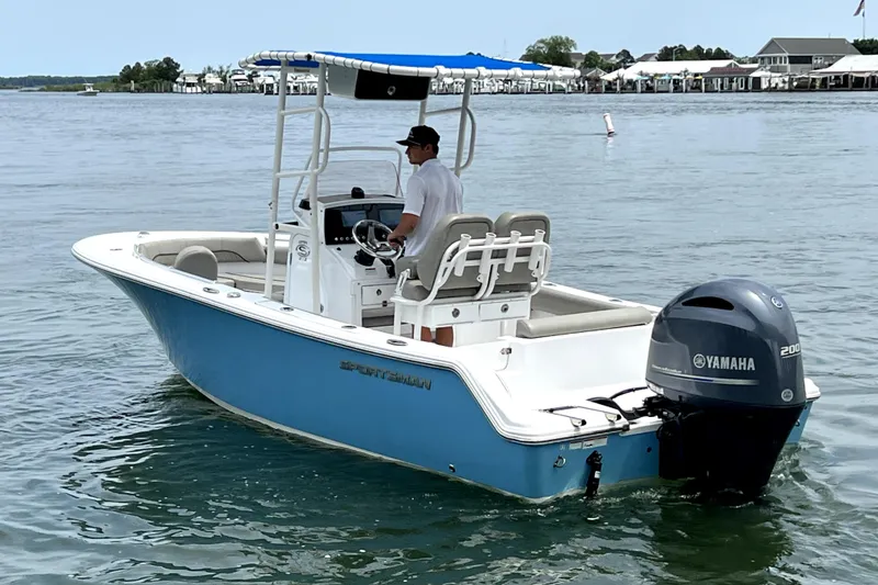 Slide: The Image of 2022 Sportsman Open 212 Center Console boat with Yamaha engine on calm water. - 3
