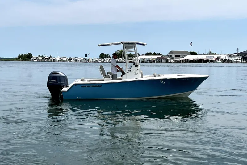 Slide: The Image of 2022 Sportsman Open 212 Center Console boat on calm water, side view. - 7