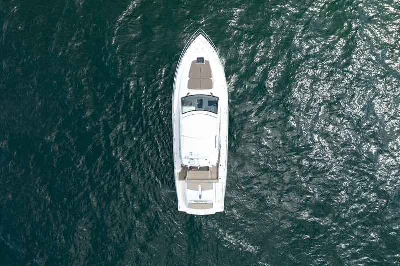 Slide: The Image of Overhead view of 2015 Pursuit SC 365i Sport Coupe on open water. - 10