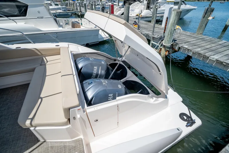 Slide: The Image of 2015 Pursuit SC 365i Sport Coupe with Yamaha engines at a marina dock. - 11