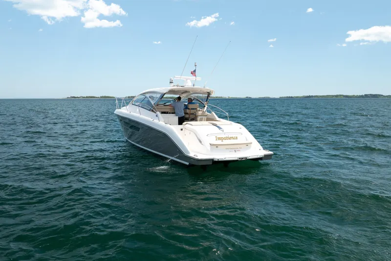 Slide: The Image of 2015 Pursuit SC 365i Sport Coupe cruising on open water under a clear sky. - 6