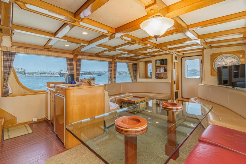 Slide: The Image of Luxurious interior of a 1990 Seaton Long Range Cruiser with panoramic windows and elegant furnishings. - 14