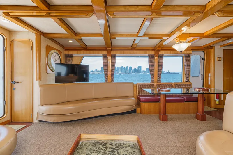 Slide: The Image of Luxurious interior of a 1990 Seaton Long Range Cruiser with city skyline view. - 15