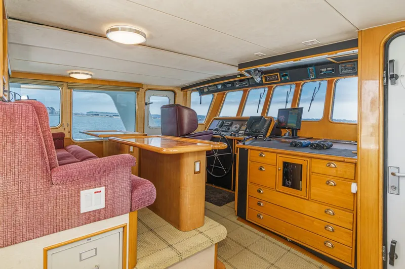 Slide: The Image of Interior of 1990 Seaton Long Range Cruiser with navigation equipment and seating. - 20