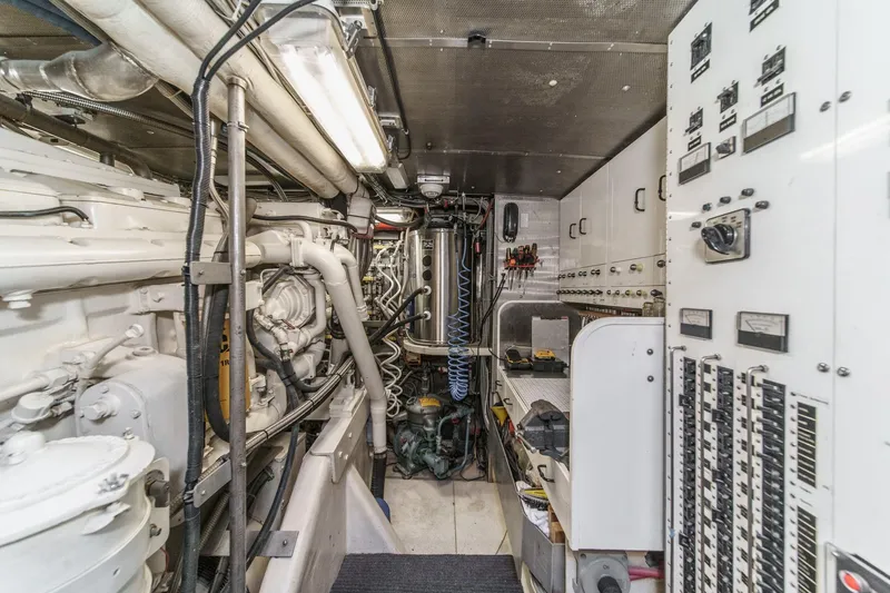 Slide: The Image of Engine room of a 1990 Seaton Long Range Cruiser, featuring complex machinery and control panels. - 29