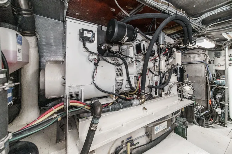 Slide: The Image of Engine room of a 1990 Seaton Long Range Cruiser with complex machinery and wiring. - 34