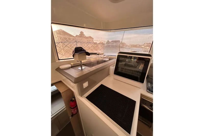 Slide: The Image of Interior of a 2018 Bali 4.1 yacht with navigation equipment and panoramic windows. - 11