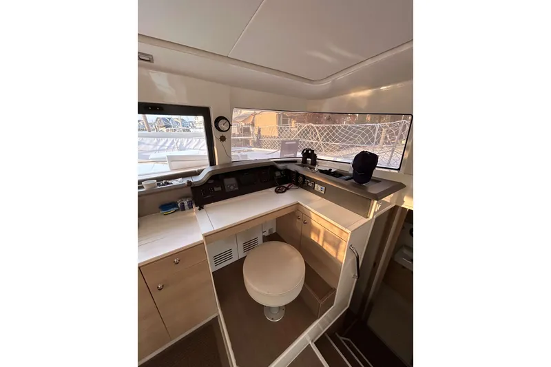 Slide: The Image of Interior of 2018 Bali 4.1 yacht cockpit with navigation equipment and seating. - 13