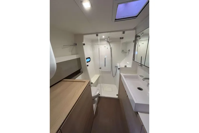 Slide: The Image of Modern bathroom interior on 2018 Bali 4.1 yacht, featuring shower, sink, and storage. - 16