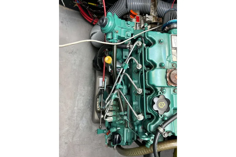 Slide: The Image of Close-up of a 2018 Bali 4.1 engine with visible components and wiring. - 18