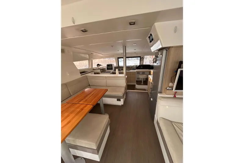 Slide: The Image of Interior of 2018 Bali 4.1 yacht with modern seating and dining area. - 8