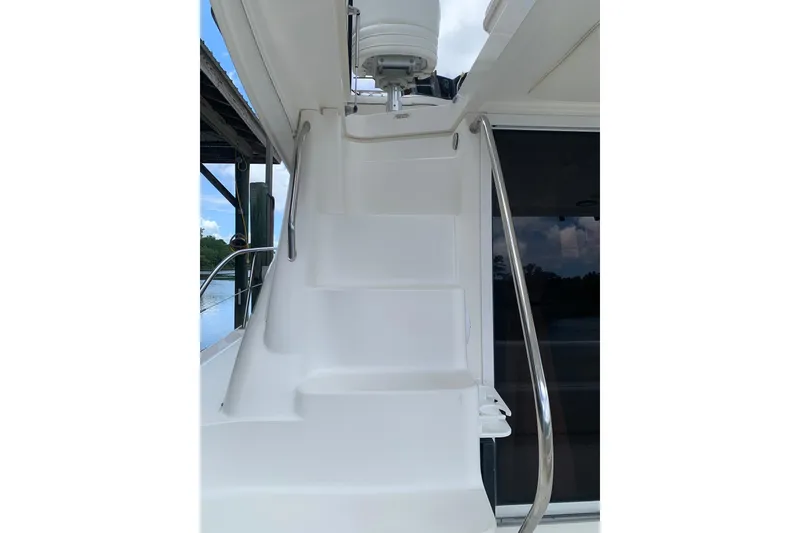 Slide: The Image of Staircase on 2004 Sea Ray 420 Sedan Bridge yacht, leading to upper deck. - 15